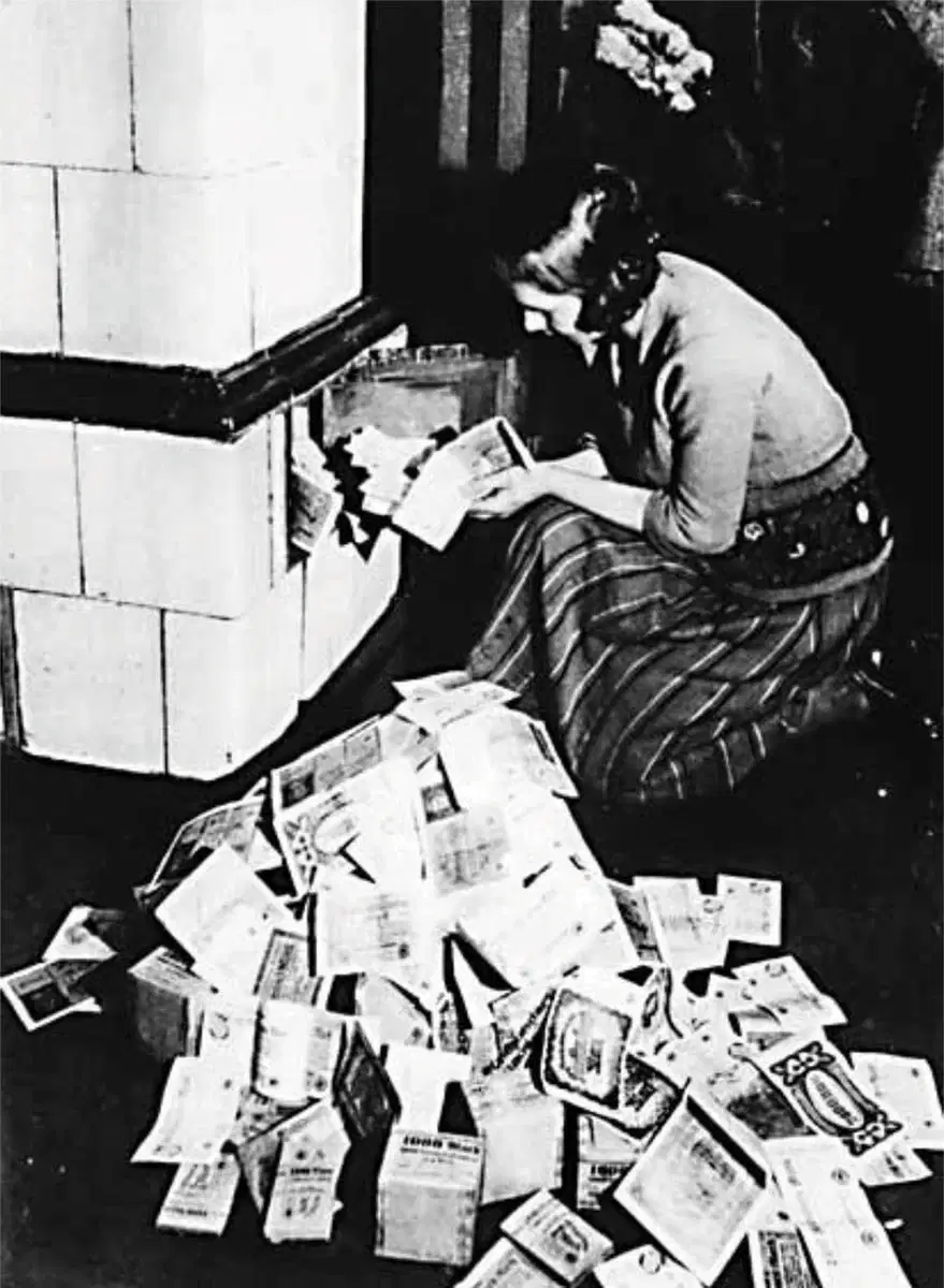 Burning German Marks during Weimar Hyperinflation, showing breakdown of monetary standards